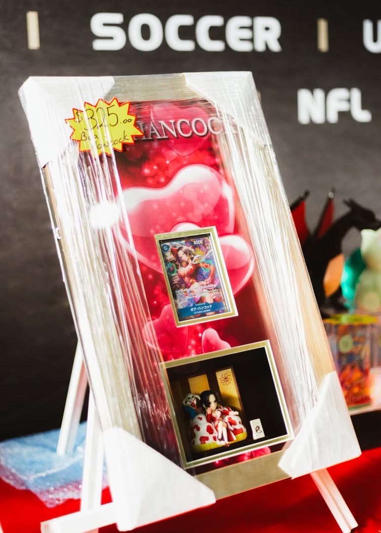 Featured One Piece card and figure display at Trakit Collectables.